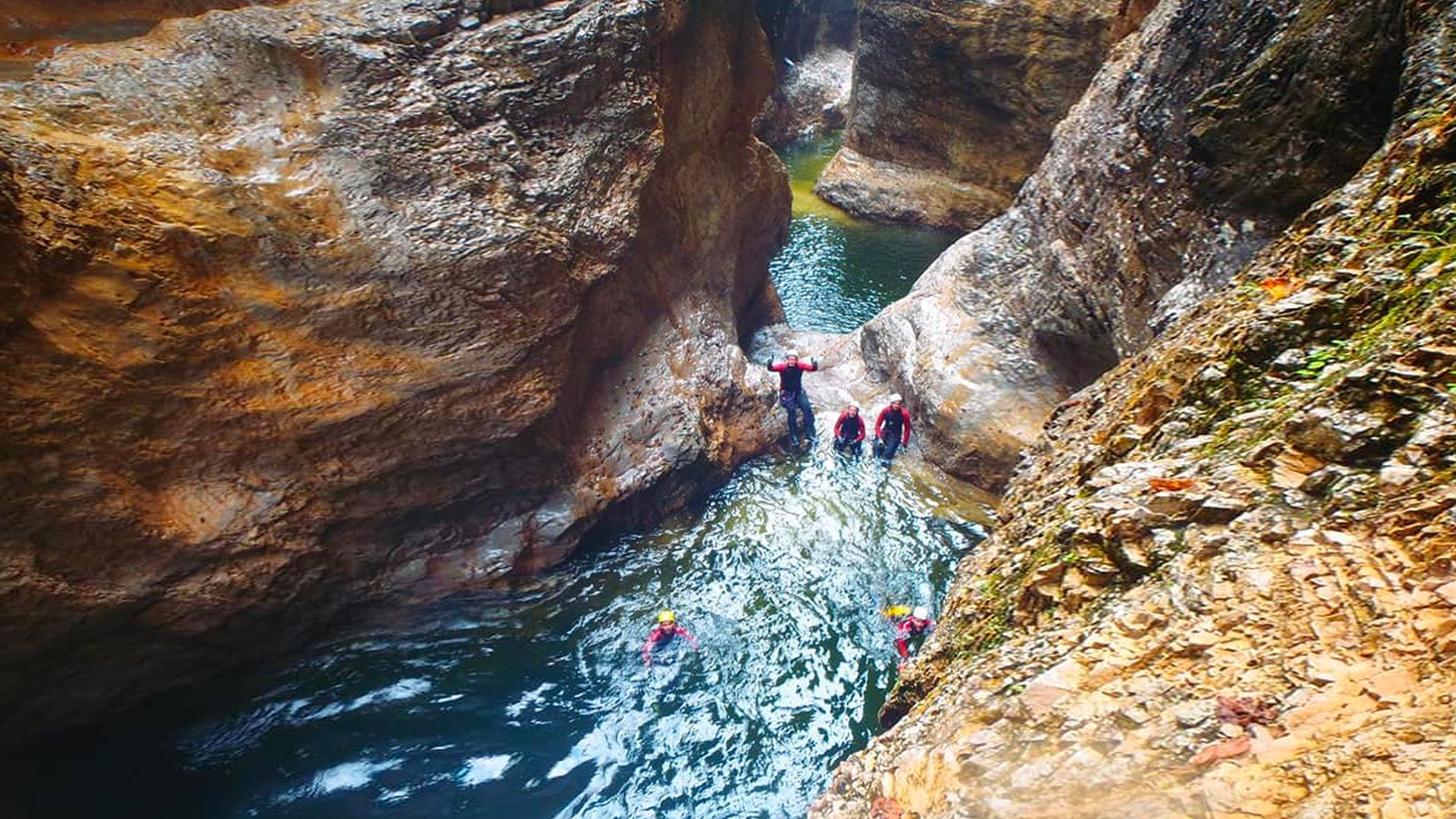 Canyoners swimming in a gorge