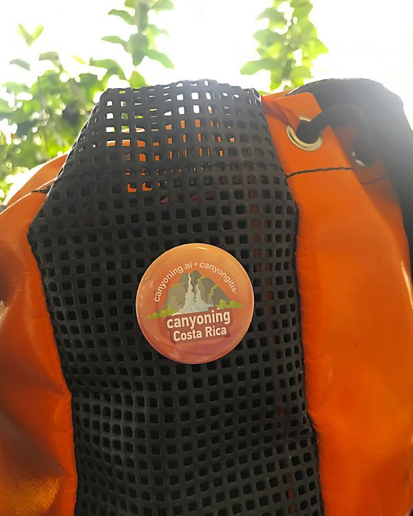 Canyoning Costa Rica badge pinned on a canyoning backpack